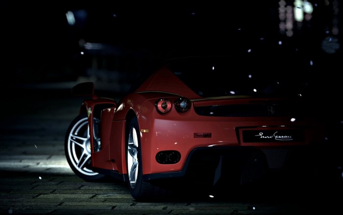 Red Ferrari Enzo sports car at night