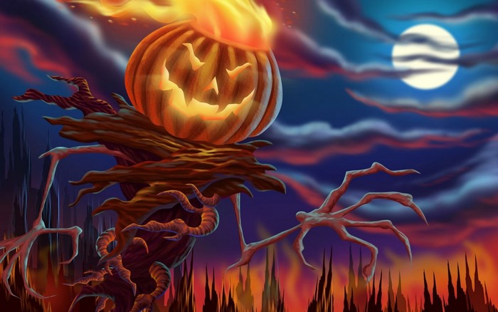 Scarecrow with Jack-o'-lantern head on fire at night