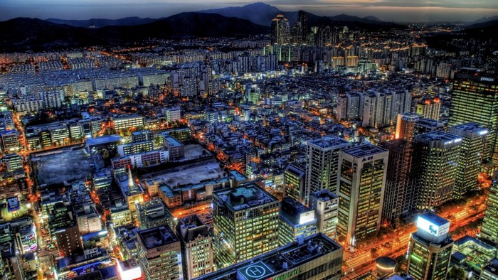 Aerial view of a sprawling city at night
