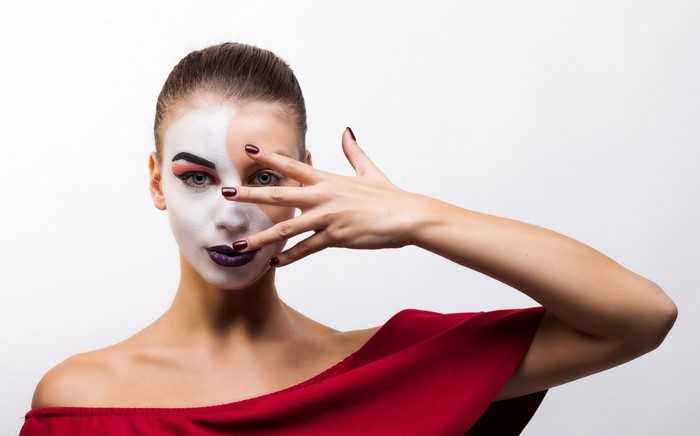 Woman with dramatic makeup and red dress