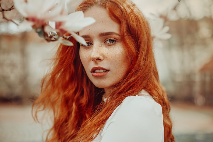 Woman with red hair and freckles