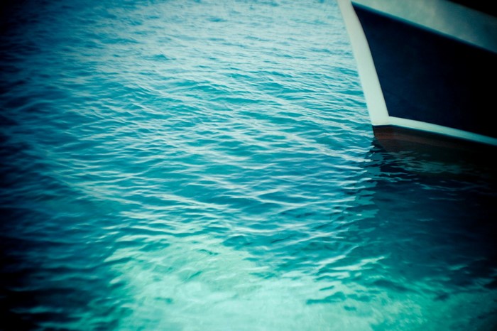 Boat bow on blue water