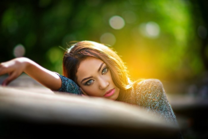 Woman with pink lipstick and blue eyes