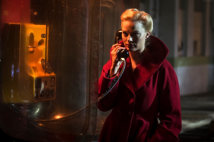 Margot Robbie using a payphone