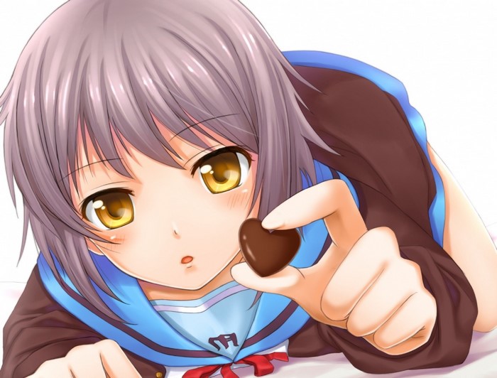 Girl offering chocolate heart