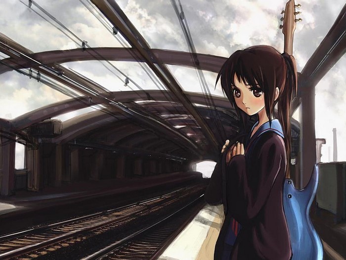 Haruhi Suzumiya with a guitar at a train station
