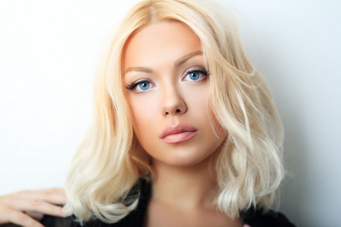 Blonde woman with blue eyes portrait