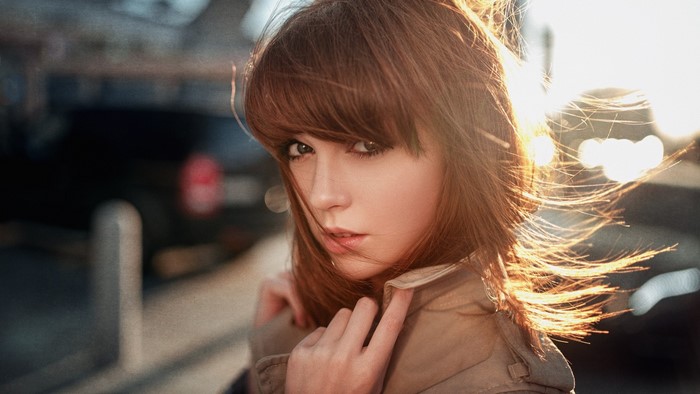 Woman with brown hair in sunlight