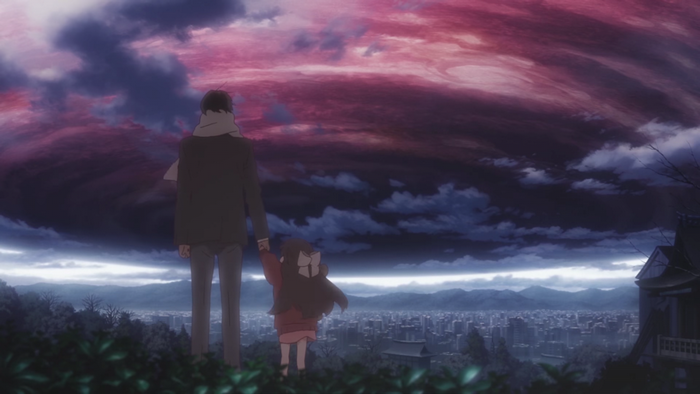 Man and child watch a dramatic sky over a city