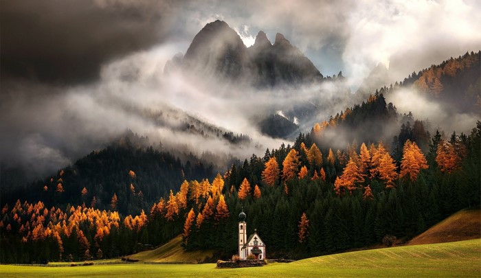 Church in the Dolomites Mountains during Autumn