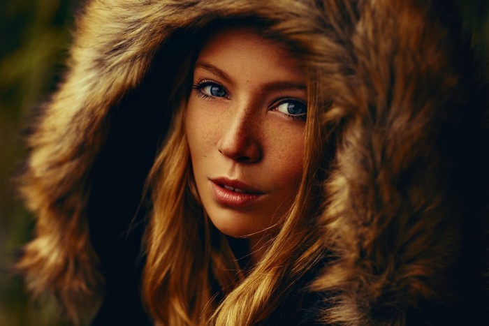 Portrait of Woman with Fur Hood and Blue Eyes