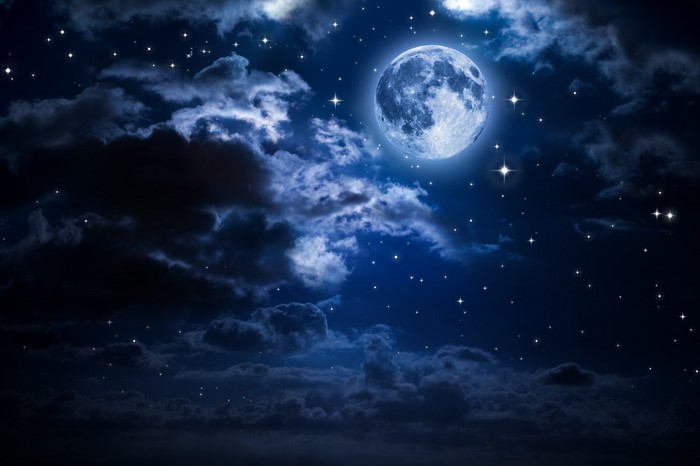 Bright Full Moon Shining Through Night Clouds