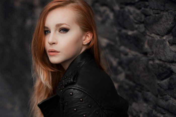 Woman with red hair and leather jacket