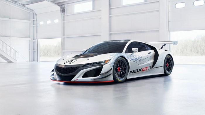 White Acura NSX GT3 race car in a garage