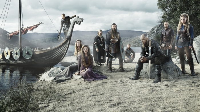 Vikings characters with a longship