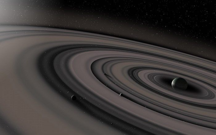 Planet with rings and moons in space