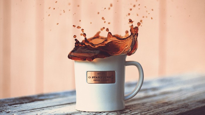 Starbucks coffee cup with splash