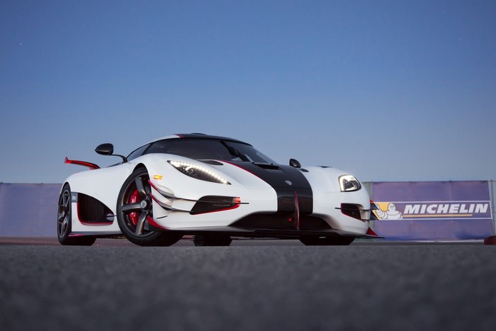 White Koenigsegg sports car with black and red accents