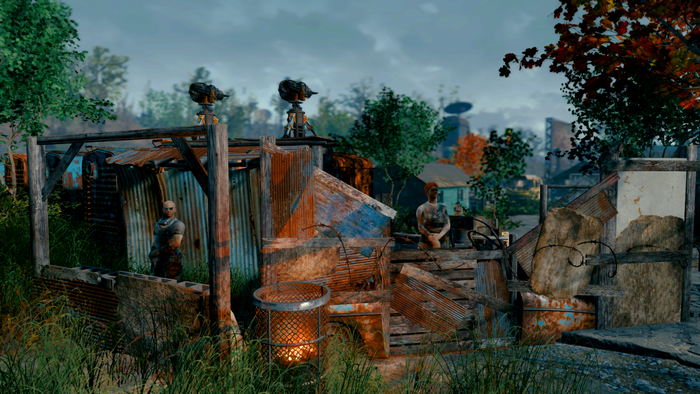 Fallout 4 screenshot of a settlement with two people