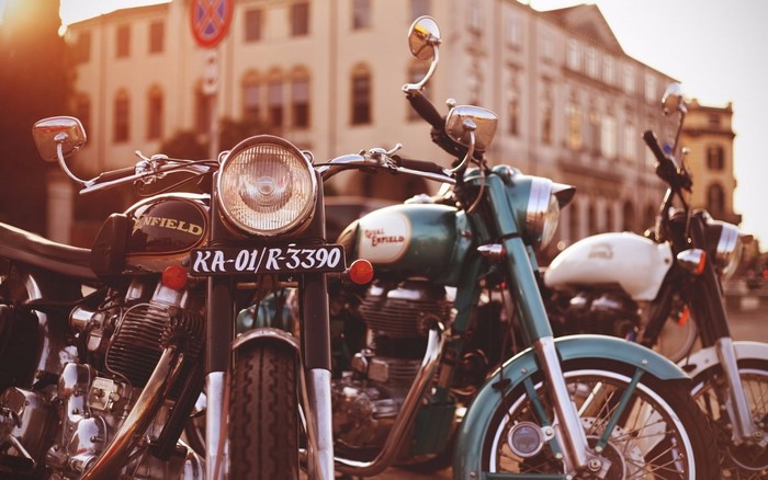 Royal Enfield motorcycles parked in front of a building