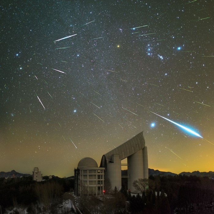 Observatory under meteor shower at night