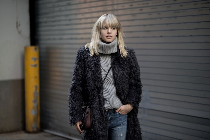 Woman wearing a fur coat and turtleneck