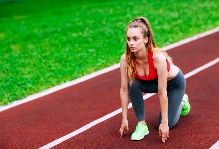 Woman in athletic wear on a running track
