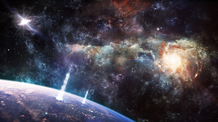 Planet with explosions in front of a spiral galaxy and nebula