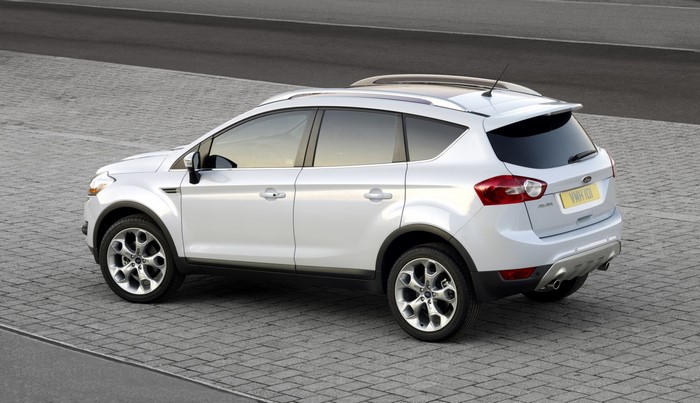 White Ford Kuga SUV parked on a paved surface