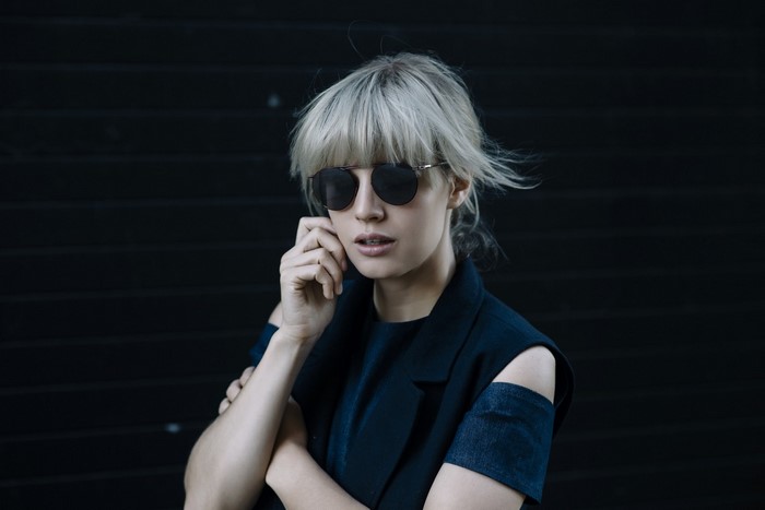 Woman with blonde hair and sunglasses