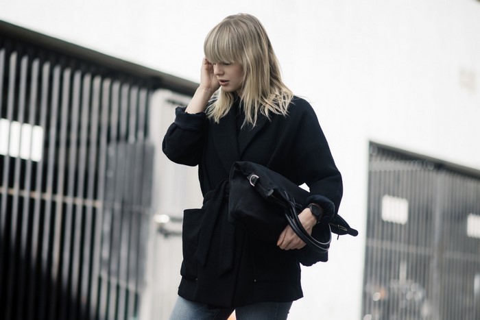 Lisa Dengler wearing a black jacket and jeans