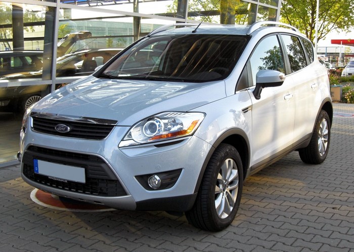 Silver Ford Kuga SUV parked outside a dealership
