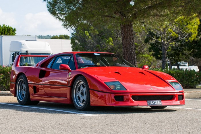Red Ferrari F40 parked outdoors