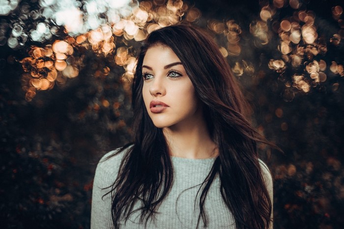 Portrait of a young woman with long brown hair