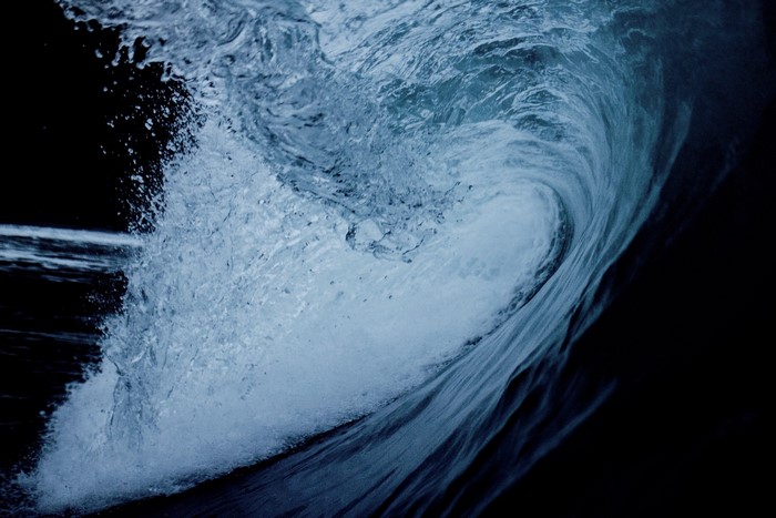 Close-up of a crashing blue ocean wave