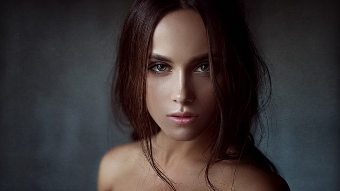 Portrait of a Woman with Intense Gaze and Long Hair