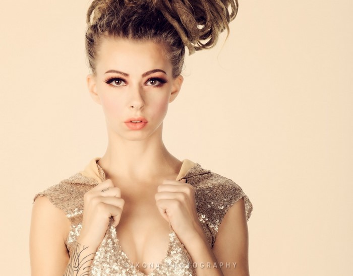 Woman with dreadlocks and sequined dress