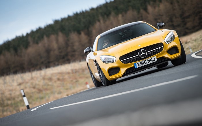 Yellow Mercedes-AMG GT S on a winding road