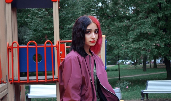 Woman with two-toned hair at a playground
