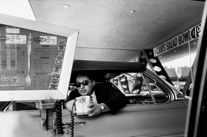 Man in car at drive-thru menu, Bruce Davidson