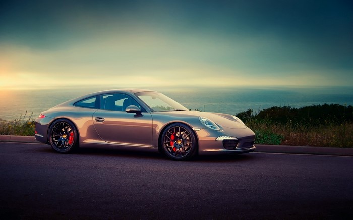 Silver Porsche 911 Coupe on a Coastal Road