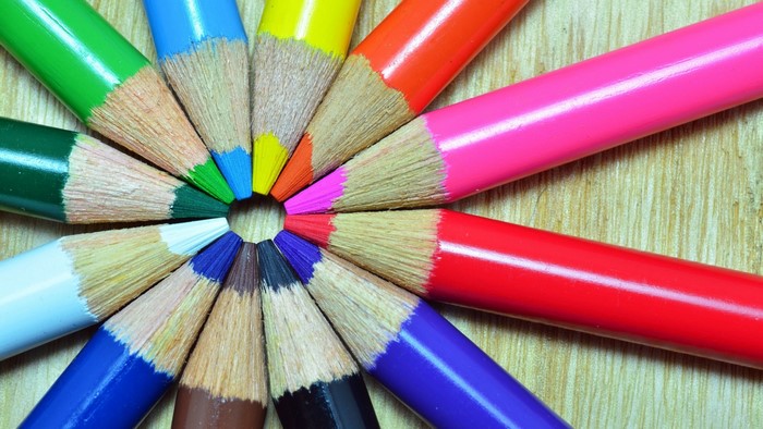 Colorful pencils arranged in a circle