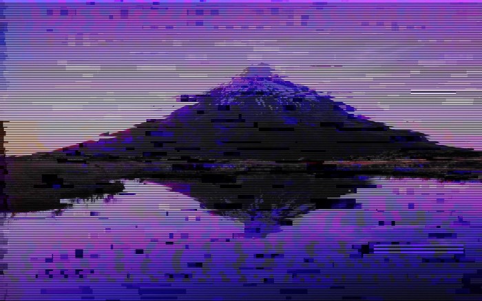 Glitch art mountain reflection in purple sky