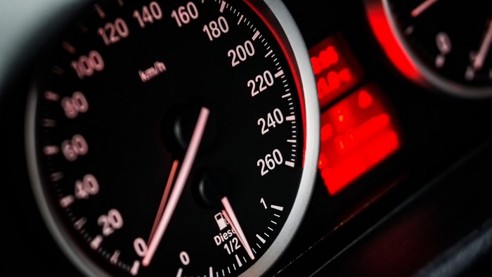 Close-up of a car speedometer and fuel gauge