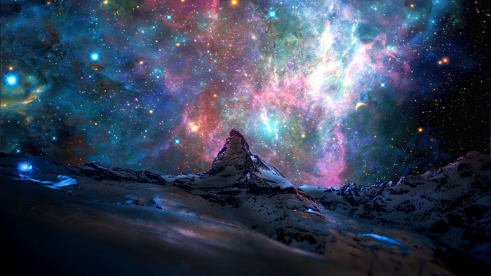 Snowy mountains under a colorful galaxy and nebula