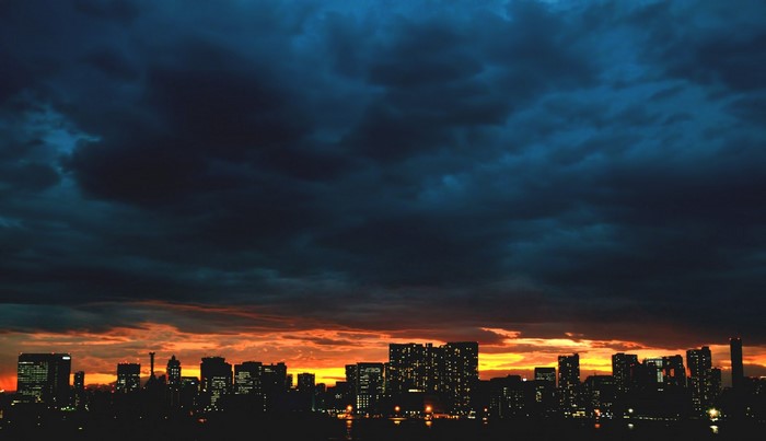 Cityscape at Dusk with Dramatic Clouds