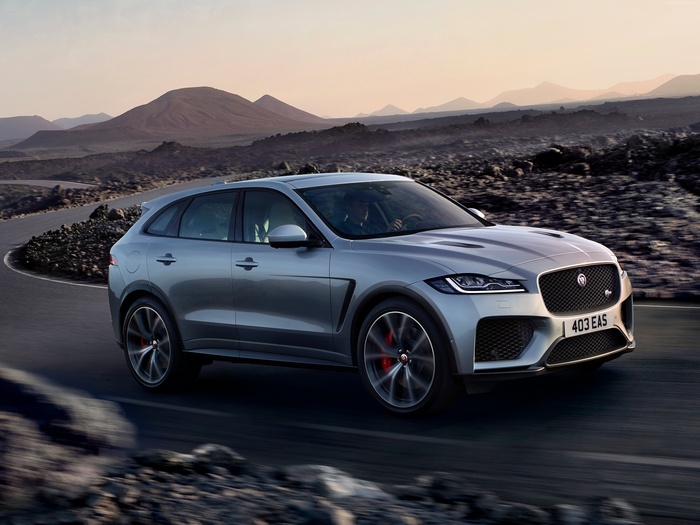 Silver 2019 Jaguar F-Pace driving on a mountain road