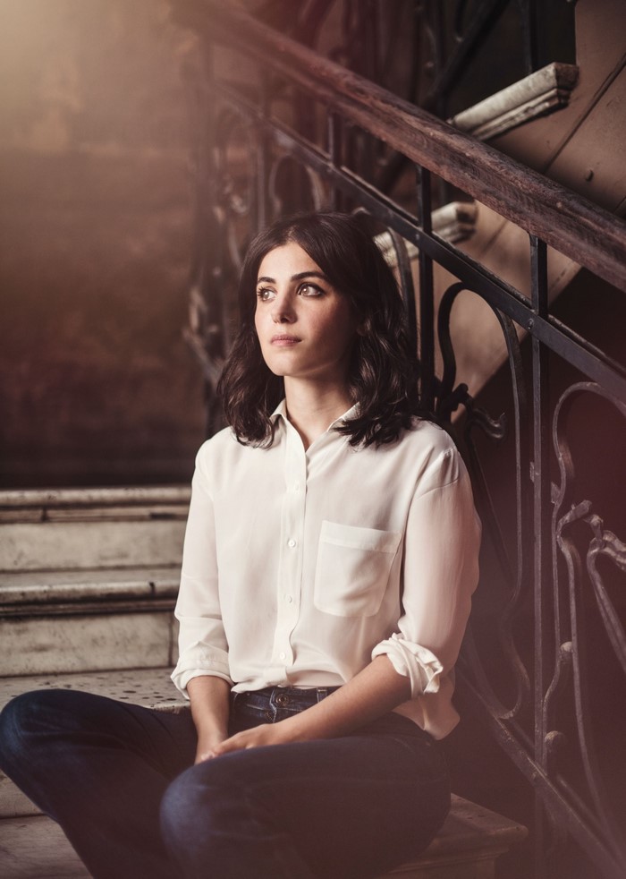 Katie Melua sitting on stairs