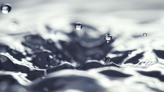 Monochrome macro photography of water drops and ripples