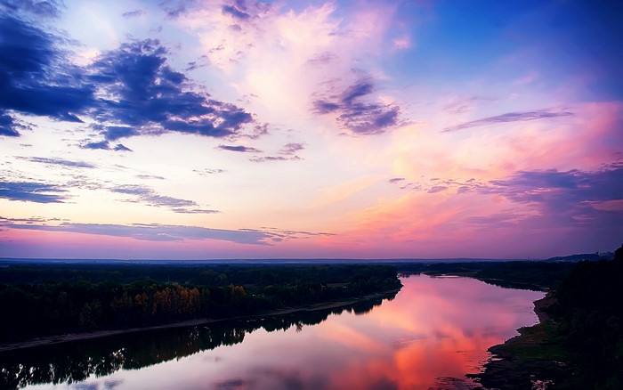 River reflecting sunset sky with clouds